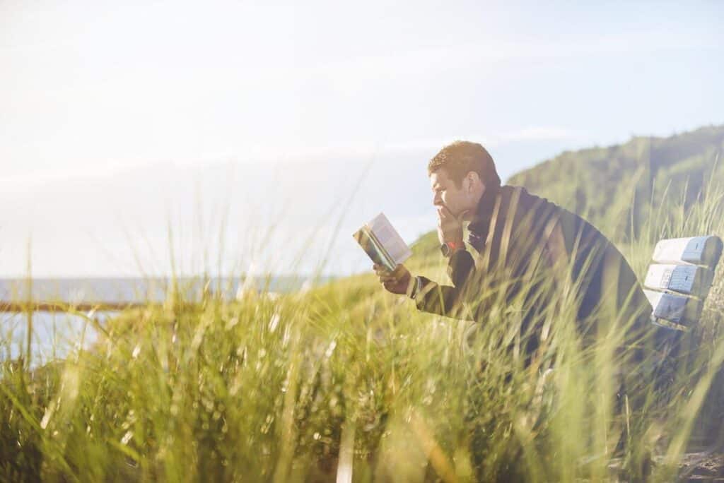 man reading in the field